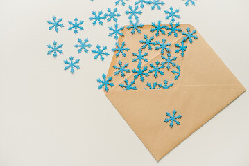 christmas tree made of paper. An envelope with snowflakes. Snowflakes in an envelope. Snowflakes flying out of the envelope.