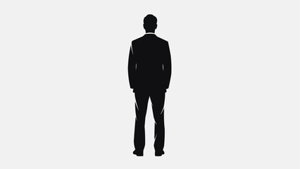 Fototapeta premium Silhouette of a man in a suit standing facing away.