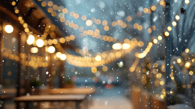 Winter scene with lights and snow at outdoor cafe in the evening