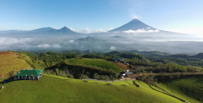 Mayon Volcano  Panorama with a beatiful blue sky and sea of clouds view of mountain hills in Tigbao Green Hills Ligao Albay Philippines 