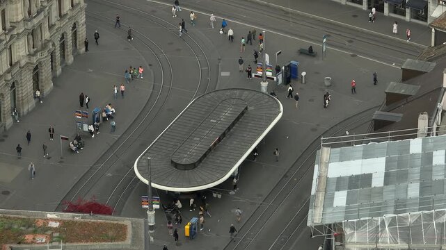 day time zurich city center tram station crowded street square aerial panorama 4k switzerland  