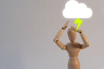 Wooden mannequin with a storm cloud, concept of stress and sorrow