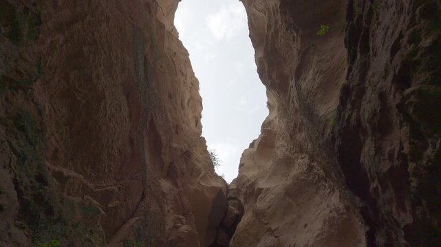 Soganli canyon walls carving against a clear sky revealing rugged rock formations in Cappadocia, Turkey