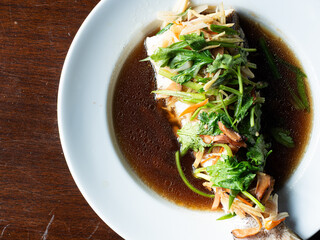 top view steamed fish in soy sauce