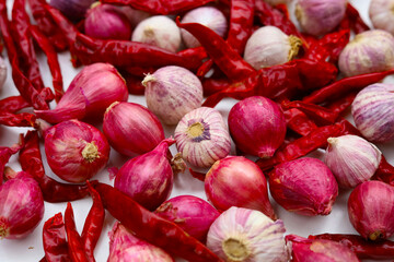 Dried red chilies, garlic bulbs and red shallots