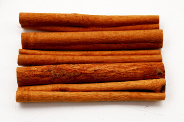 Dried cinnamon sticks arranged in a bundle.