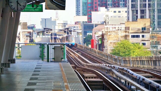 Urban Elevated Train Approaching City Station Platform