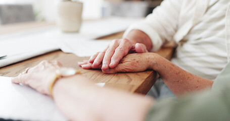 Holding hand, support and senior couple in house with application for retirement home together. Love, compassion and elderly people for will documents with marriage, trust and care in apartment.