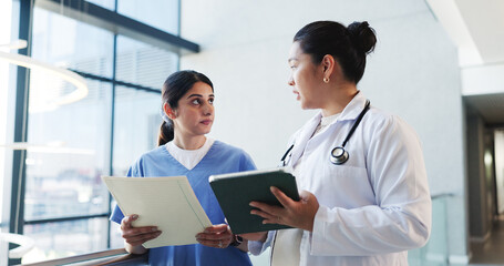 Doctor, tablet and nurse with folder feedback in clinic for treatment solution, opinion or advice....