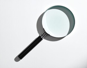 Magnifying glass casts sharp shadow on white background