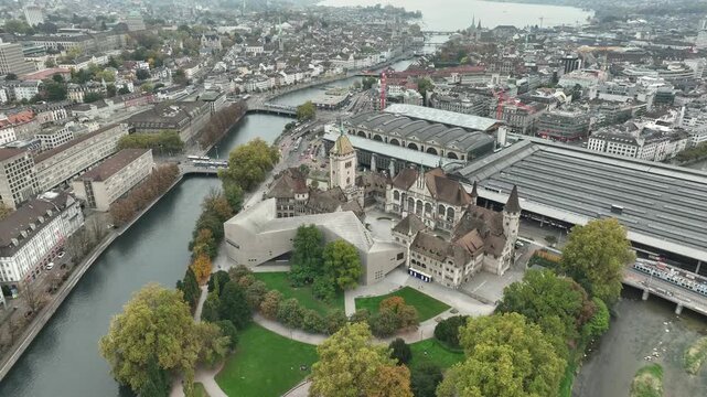 day time flight over zurich city center riverside train station museum exterior aerial panorama 4k switzerland   