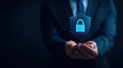Cyber security concept man holding digital shield with padlock icon for data protection and network safety in dark corporate environment