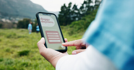Veterinarian, hands and woman with smartphone screen, outdoor and notification for booking. Nature, professional and person with cellphone, animal shelter and subscription for doggy daycare or review