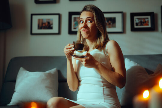 Woman Being Uncomfortable Having Coffee During Visit. Girlfriend experiencing a bad date feeling awkward 