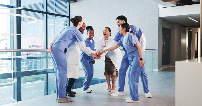 Excited, nurses and doctors with handstack in hospital for celebration, surgery success and victory. Happy, healthcare people and huddle for medical milestone, staff motivation and team achievement