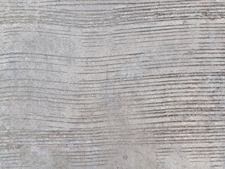 The concrete floor has stripes.