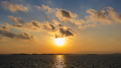Sunset Sky and Layered Clouds Over the Sea