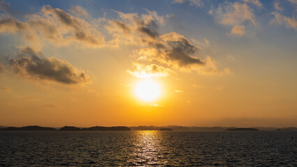 Sunset Sky and Layered Clouds Over the Sea