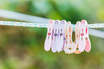 Clothespins on a Clothesline with Rain Droplets