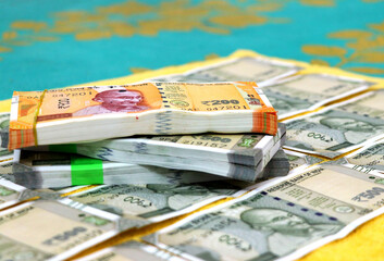 piles of new indian currency notes rupees 50,100,200 and 500