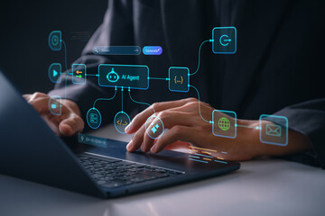 AI agent controlling intelligent automation processes on laptop by software developer in modern office, generating code, managing digital tasks and analyzing data through virtual interface