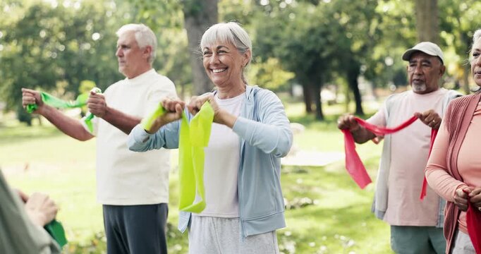 Resistance band, fitness and class with old woman in nature for workout, stretching and health. Exercise, retirement and wellness with senior people learning in park for personal trainer and club