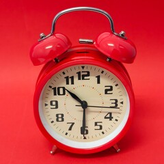 Close-up of a red twin bell alarm clock. Isolated. Concept of time. Copy space.