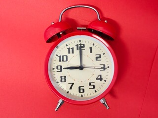Close-up of a red twin bell alarm clock. Isolated. Concept of time. Copy space.