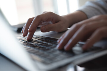 Close up, woman hands typing on laptop computer keyboard, surfing the internet on office table, online, working, business and technology, internet network communication concept