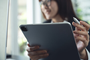 Video call, online meeting with colleagues meeting remote event, businesswoman at office using computer and digital tablet at work joining web conference via online meeting app, video conference