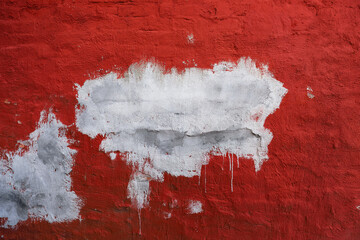 Old red painted brick wall with cement patch