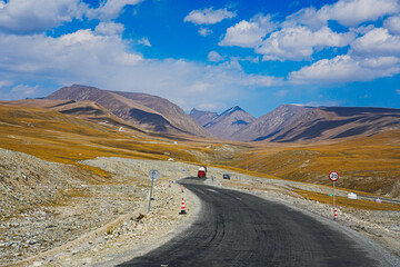 a vast panoramic view of alpine meadows and natural grasslands.