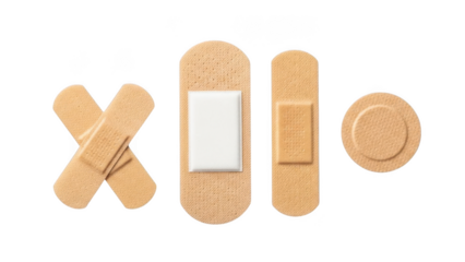 A collection of various adhesive bandages for first aid against a black background