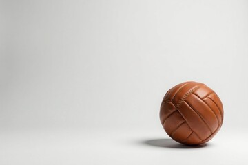 A Classic Brown Leather Ball on a White Background, a Symbol of Vintage Sports and Timeless Design