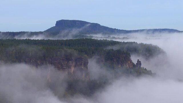 floating inversion clouds in the rocky canyon of the Elbe River-timelapse