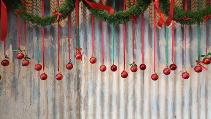 Festive Ornament Display: A cheerful scene with red Christmas ball ornaments elegantly suspended,...