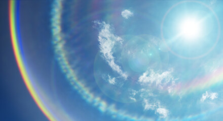 夏の晴天、青空に流れる積乱雲ふわふわの入道雲とギラギラ輝く太陽とレンズフレアとゴーストの背景壁紙　夏・夏休み・行楽・バカンス・アウトドア・キャンプ・天気・台風一過・季節