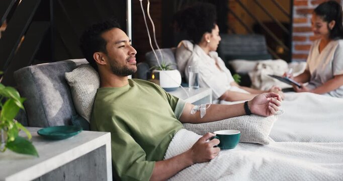 Coffee, iv drip and man with healthcare, vitamin b and supplements with antibiotics. Patient, caffeine and happy person with chemotherapy, espresso and electrolytes with medical service and wellness