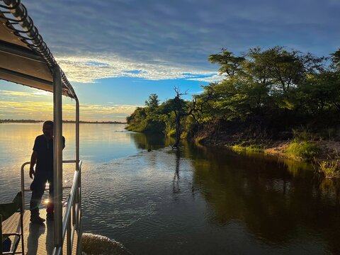 Hippo cruise with a boat along the Namibian and Angolan border on Okavango river in Caprivi-Strip