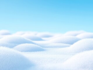 A calming, high-key image of snow-covered hills under a clear blue sky, offering a peaceful vista.