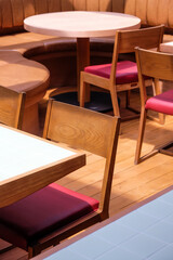 Wooden chairs and tables in a cafe, closeup of photo