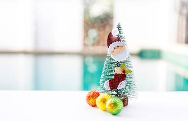Santa Clause with Christmas tree and ornament over blurred background, Christmas card background idea