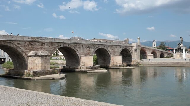  Stone bridge over Vardar river, Skopje. Urban construction and city infrastructure in Central Municipality in capital of Macedonia.