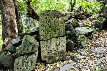 cross-stone in green forest