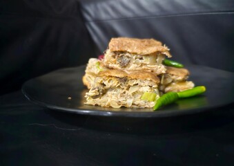 apple pie with almonds Martabak telur,Egg martabak,Murtabak,Mutabbaq,suffed pancake,Pan fried bread with egg,meat,spring onion and vegetables filling,served with sambal or cayenne pepper,achar or pick