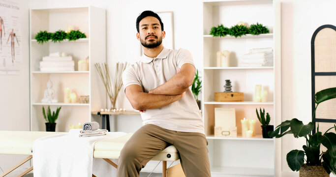 Portrait, man and physiotherapist in office with arms crossed, wellness or medical service. Confidence, person and physical therapist in health clinic for healing, chiropractor and professional pride - Powered by Adobe