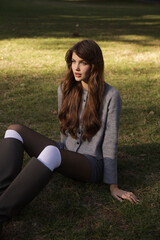  beautiful young slavic woman with long dark natural hair in elegant clothes