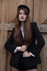  beautiful young slavic woman with long dark natural hair in elegant clothes