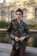  beautiful young slavic woman with long dark natural hair in elegant clothes