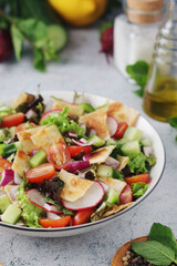 A bowl with Fattoush - Traditional Levantine salad	